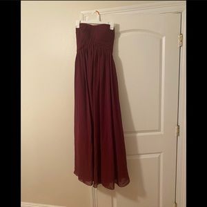 Purchased from Amazon. Size varies S-L bc of adjustable tied back. Burgundy.